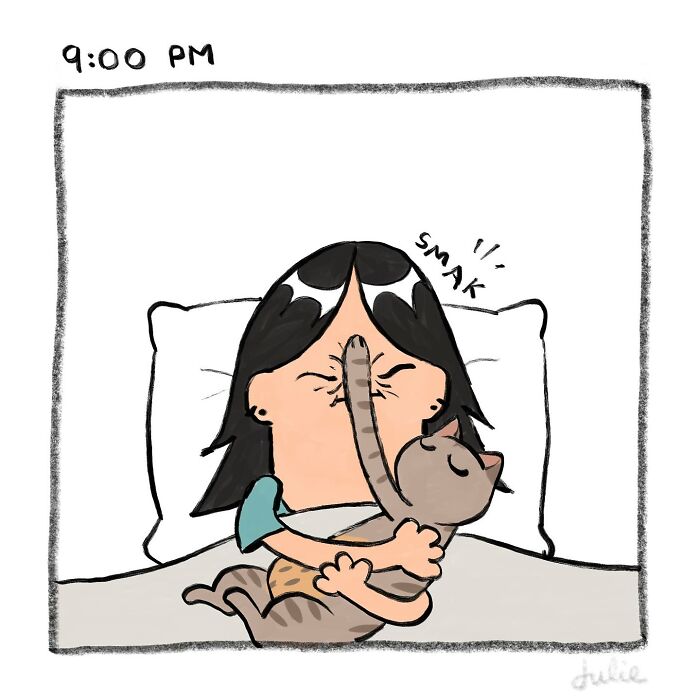 Woman hugging a cat in bed at 9 PM, with the cat playfully smacking her face, capturing ups and downs of life.