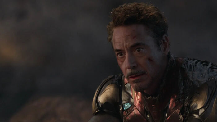 Close-up of a wounded man in futuristic armor, a scene from one of the greatest films of the new millennium.