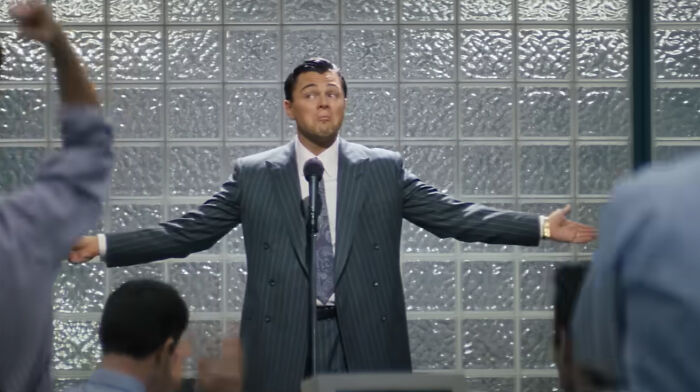 Actor performing a confident speech scene from one of the new millennium's greatest films in a professional setting.