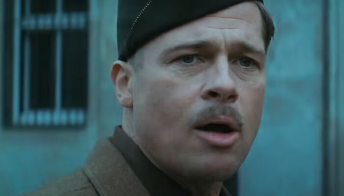Close-up of a man in military uniform expressing emotion in a dramatic scene from one of the new millennium's greatest films.