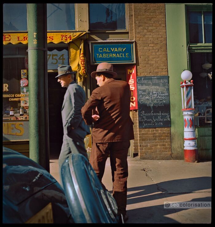Two men in hats walking past a Calvary Tabernacle with a vintage storefront in magical historical photos colorized.