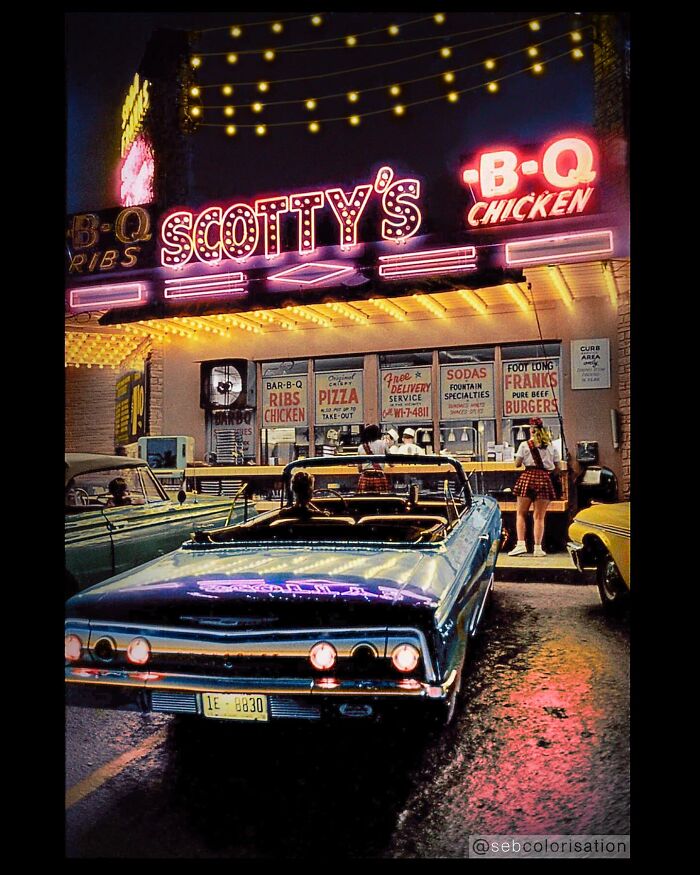 Colorized historical photo of a vintage 1960s car parked outside Scotty's BBQ chicken restaurant at night.