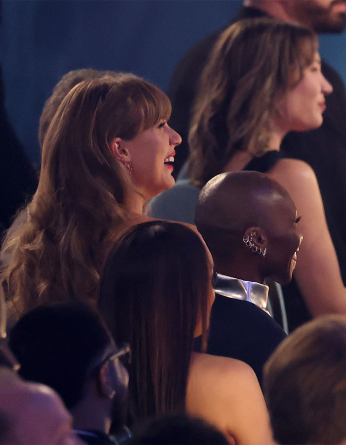 Fans reacting and discussing Taylor Swift as Dorothy in the new Wicked movie during an event audience scene. Fans reacting and discussing Taylor Swift as Dorothy in the new Wicked movie during an event audience scene.