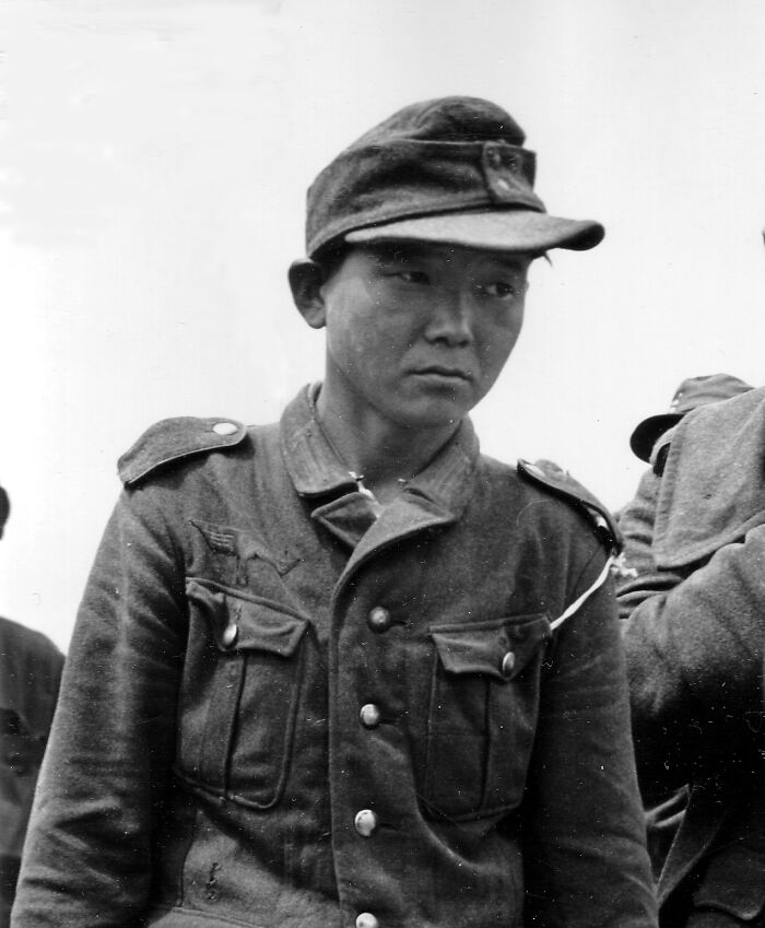 Black and white photo of a serious soldier in historical military uniform representing historical facts to amaze you.