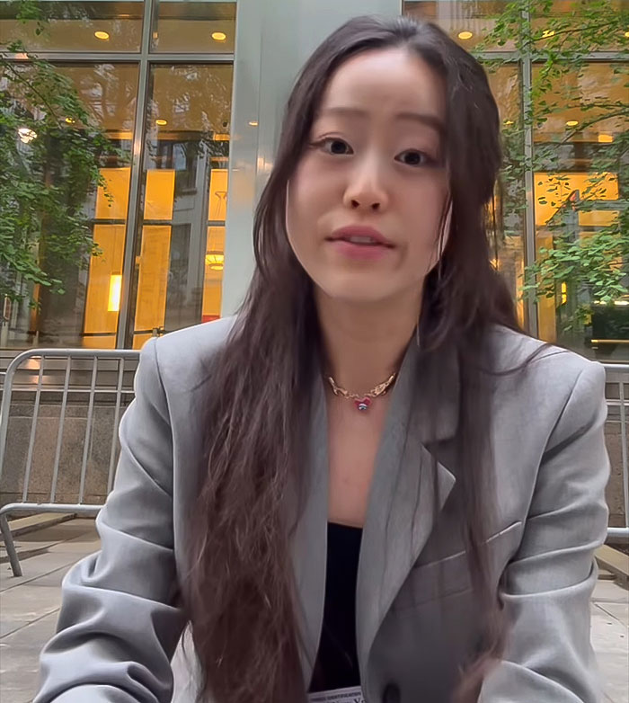 Woman outside courthouse revealing Diddy's aged look during trial, wearing gray blazer and speaking directly to camera.