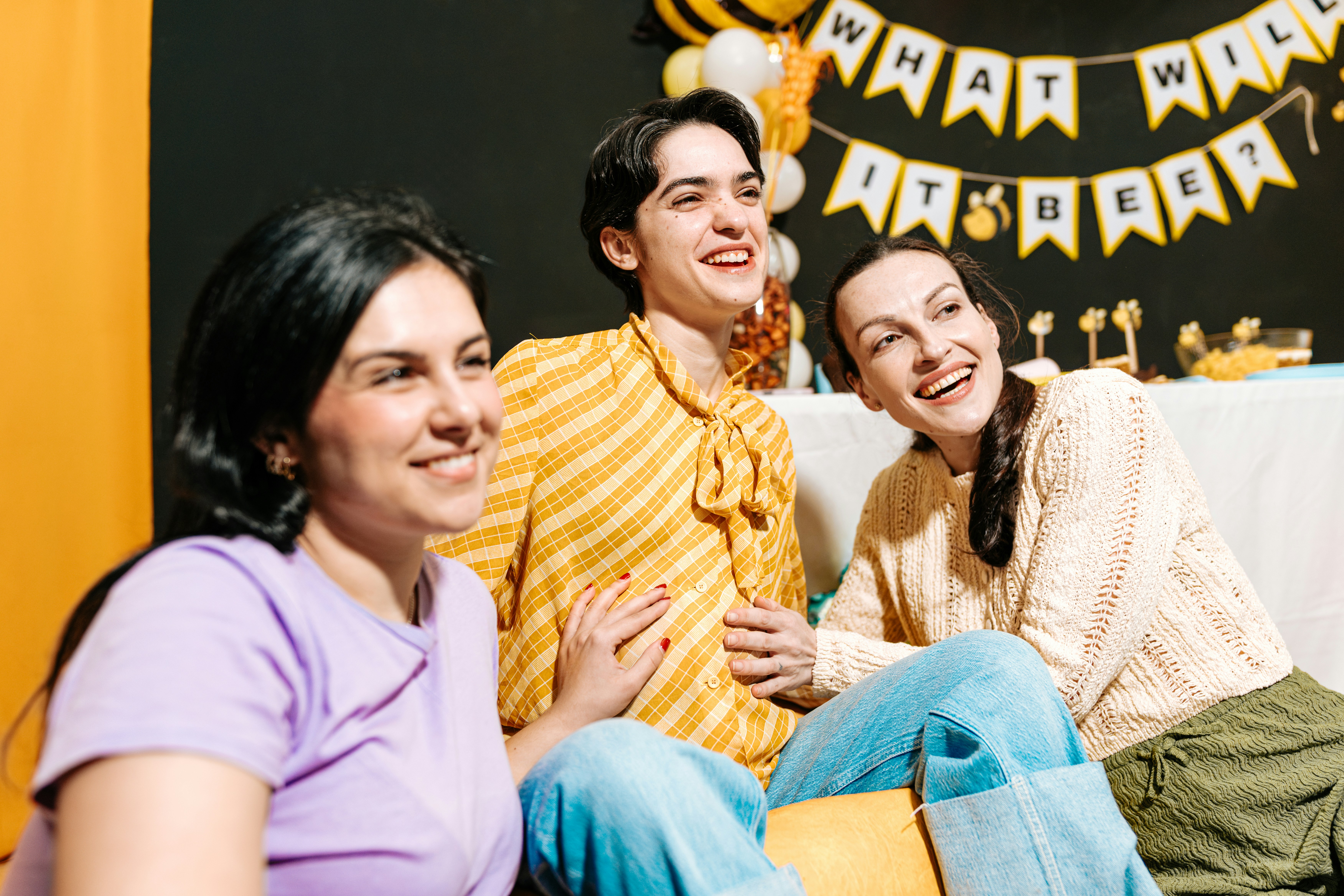 Three women smiling and laughing indoors, reflecting boundaries and a woman having enough of her friend using her. Three women smiling and laughing indoors, reflecting boundaries and a woman having enough of her friend using her.