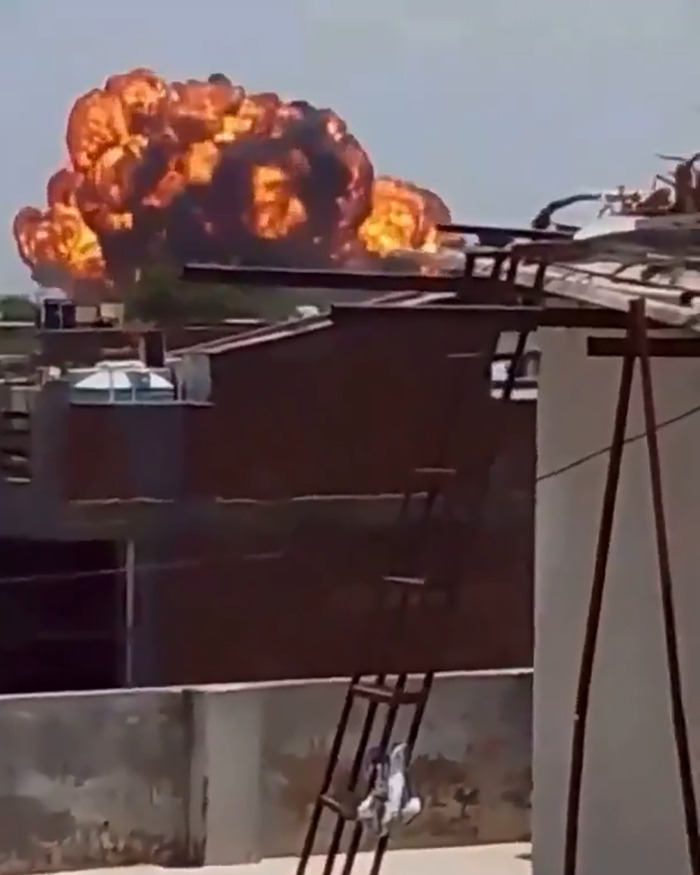 Explosion and fireball in the sky captured in a new enhanced clip of Air India plane before crash investigation. Explosion and fireball in the sky captured in a new enhanced clip of Air India plane before crash investigation.