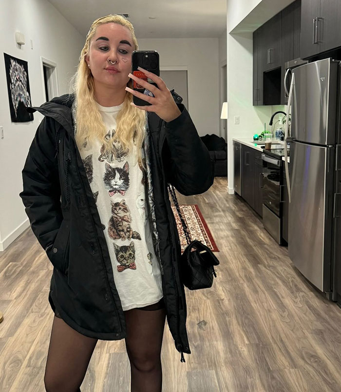 Amanda Bynes taking a mirror selfie indoors, wearing a black jacket and cat graphic shirt, related to Ozempic use news. Amanda Bynes taking a mirror selfie indoors, wearing a black jacket and cat graphic shirt, related to Ozempic use news.