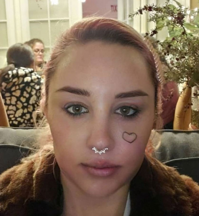 Amanda Bynes with septum piercing and heart tattoo on cheek after revealing she is using Ozempic sparking mixed reactions. Amanda Bynes with septum piercing and heart tattoo on cheek after revealing she is using Ozempic sparking mixed reactions.