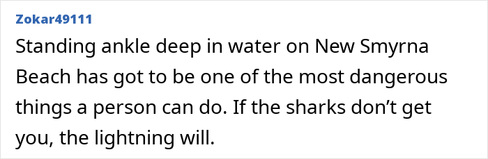 Newlywed standing ankle deep in water on New Smyrna Beach facing danger from sharks and lightning. Newlywed standing ankle deep in water on New Smyrna Beach facing danger from sharks and lightning.