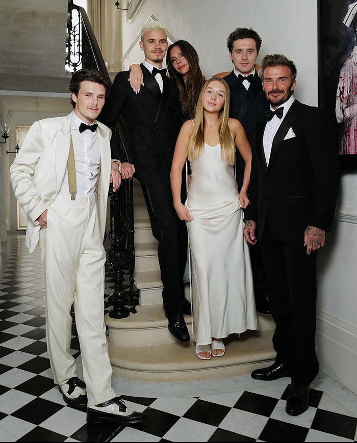 Brooklyn Beckham and family dressed formally, posing on staircase in a stylish home amid reported no contact feud. Brooklyn Beckham and family dressed formally, posing on staircase in a stylish home amid reported no contact feud.