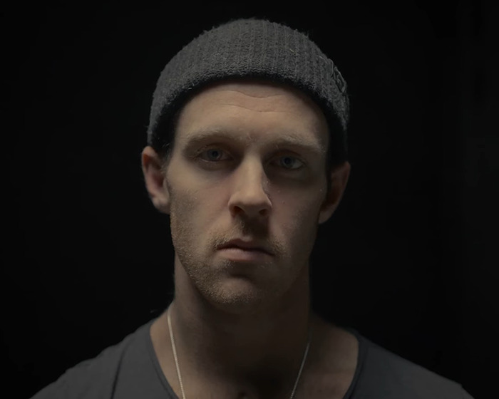 Young Jiu-Jitsu student wearing a gray beanie, looking solemn after a tragic freak accident in sparring incident. Young Jiu-Jitsu student wearing a gray beanie, looking solemn after a tragic freak accident in sparring incident.