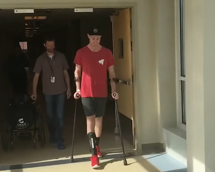 Young jiu-jitsu student on crutches after tragic freak accident during sparring with black-belt trainer. Young jiu-jitsu student on crutches after tragic freak accident during sparring with black-belt trainer.