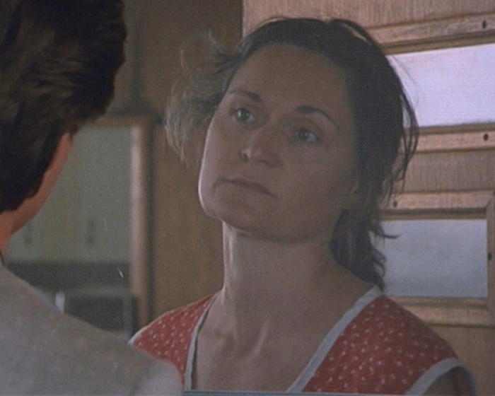 Beloved 90s star and Rain Man co-star in a vintage film scene looking serious and contemplative indoors. Beloved 90s star and Rain Man co-star in a vintage film scene looking serious and contemplative indoors.