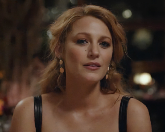 Blake Lively looking thoughtful in a dimly lit setting amid lawsuit news involving Justin Baldoni. Blake Lively looking thoughtful in a dimly lit setting amid lawsuit news involving Justin Baldoni.
