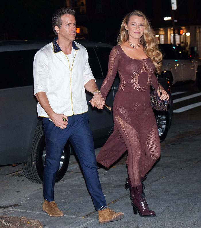 Couple walking hand in hand at night in the city, illustrating a scene related to pushy influencer rejection by Taylor Swift. Couple walking hand in hand at night in the city, illustrating a scene related to pushy influencer rejection by Taylor Swift.