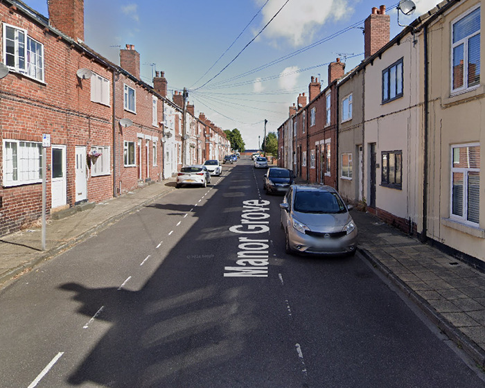 Residential street with parked cars and brick houses on both sides, related to boy 12 passes away viral scarf challenge news. Residential street with parked cars and brick houses on both sides, related to boy 12 passes away viral scarf challenge news.