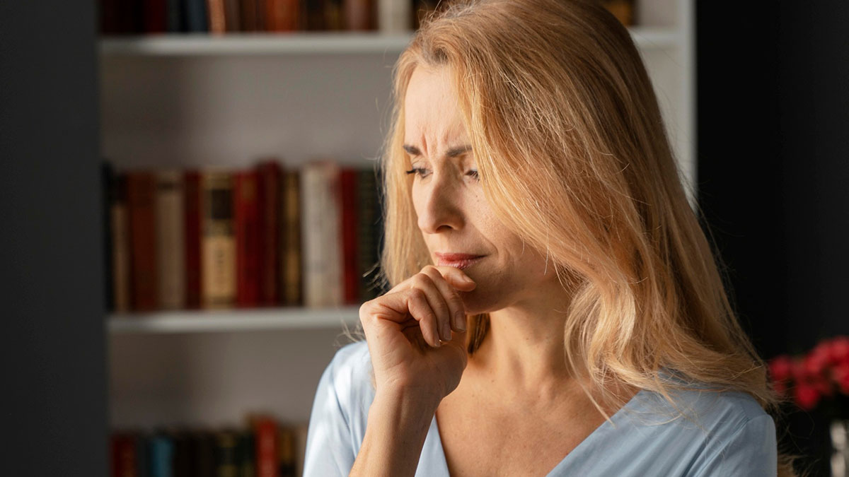Worried woman reflecting deeply, symbolizing wife wondering if hubs loves her despite 8-year affair and bizarre situation.