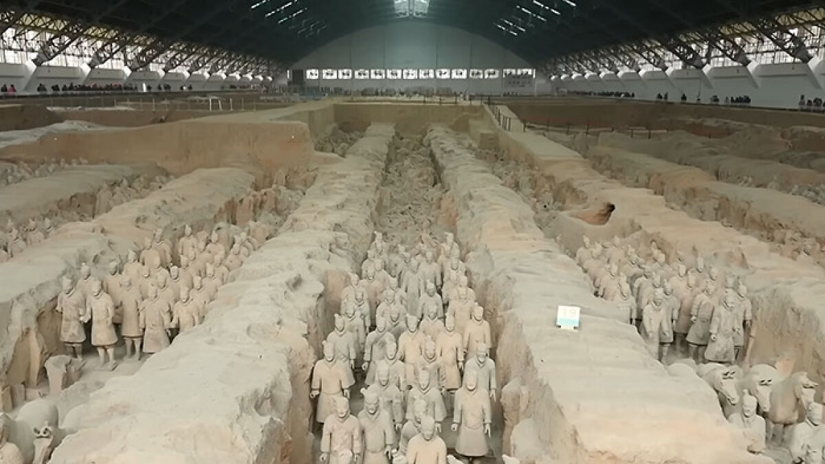 Rows of 2000-year-old statues inside a large covered archaeological site damaged by a tourist jumping into an 18-foot pit.