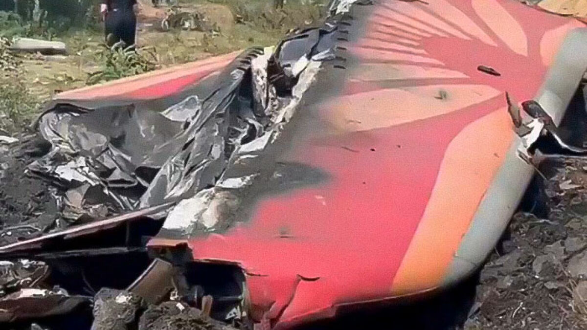 Wreckage of Air India Boeing jet showing damage after crash, highlighting tech failures exposed by passenger hours earlier.