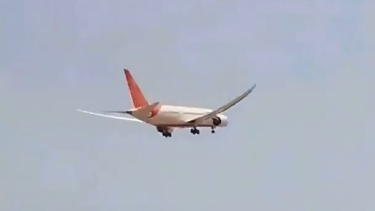 Air India plane in flight with landing gear down captured in new enhanced clip before crash accident investigation.