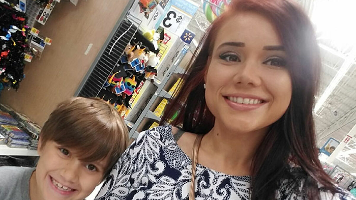 Whitney Purvis smiling with young boy in a store, related to 16 And Pregnant star missing son's funeral reported late.