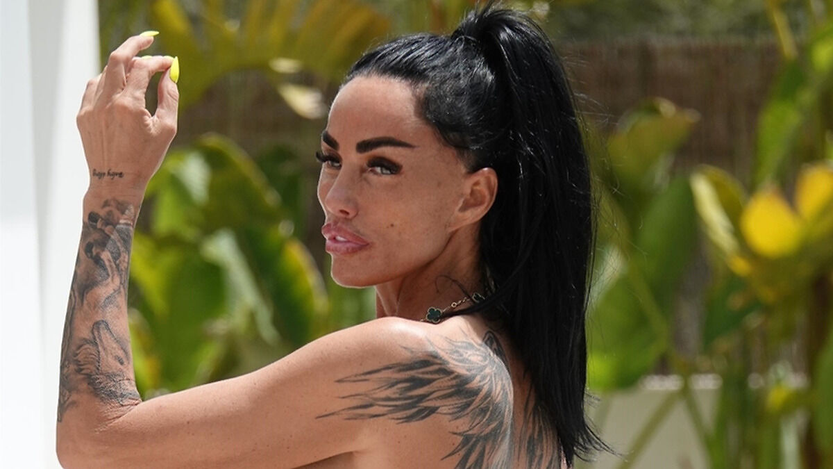 Katie Price showing results of her painful BBL surgery during holiday, posing with tattoos and long black ponytail.