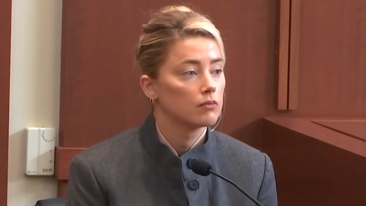 Woman speaking as a Johnny Depp trial juror in a courtroom setting, sharing insights during a legal proceeding.
