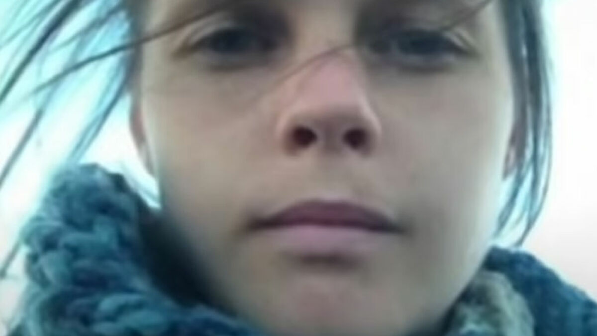 Close-up of an Australian woman outdoors, illustrating the risks of consuming excessive amounts of caffeine.