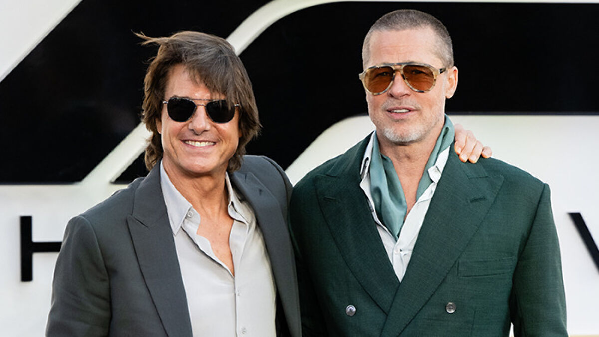 Tom Cruise and Brad Pitt posing together at the F1 premiere, sparking Botox rumors about Tom Cruise.