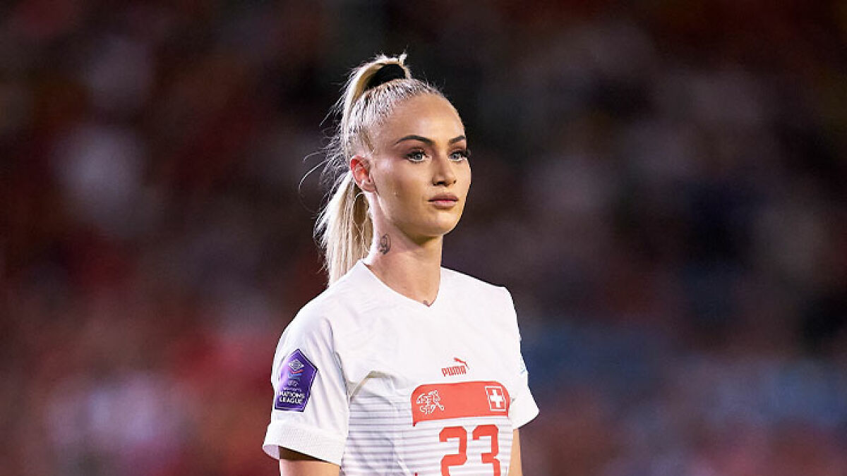 Female national soccer team player in white jersey with number 23, looking focused during a match.