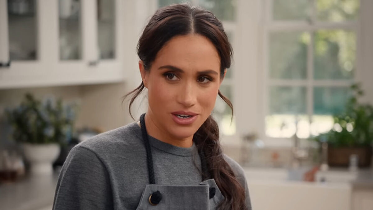Meghan Markle wearing an apron in a bright kitchen, linked to fans discovering her brand's products from Williams Sonoma