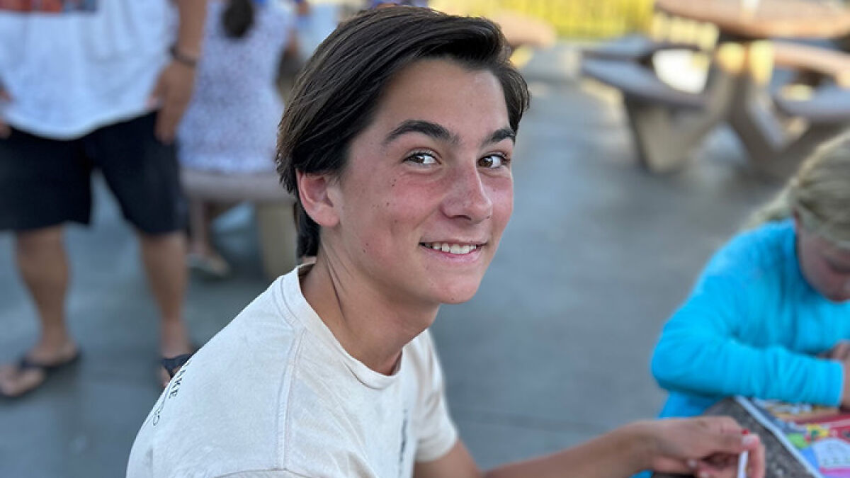 Teenage boy smiling outdoors, capturing the moment before terrifying hallucinating words led to tragic cliff fall.