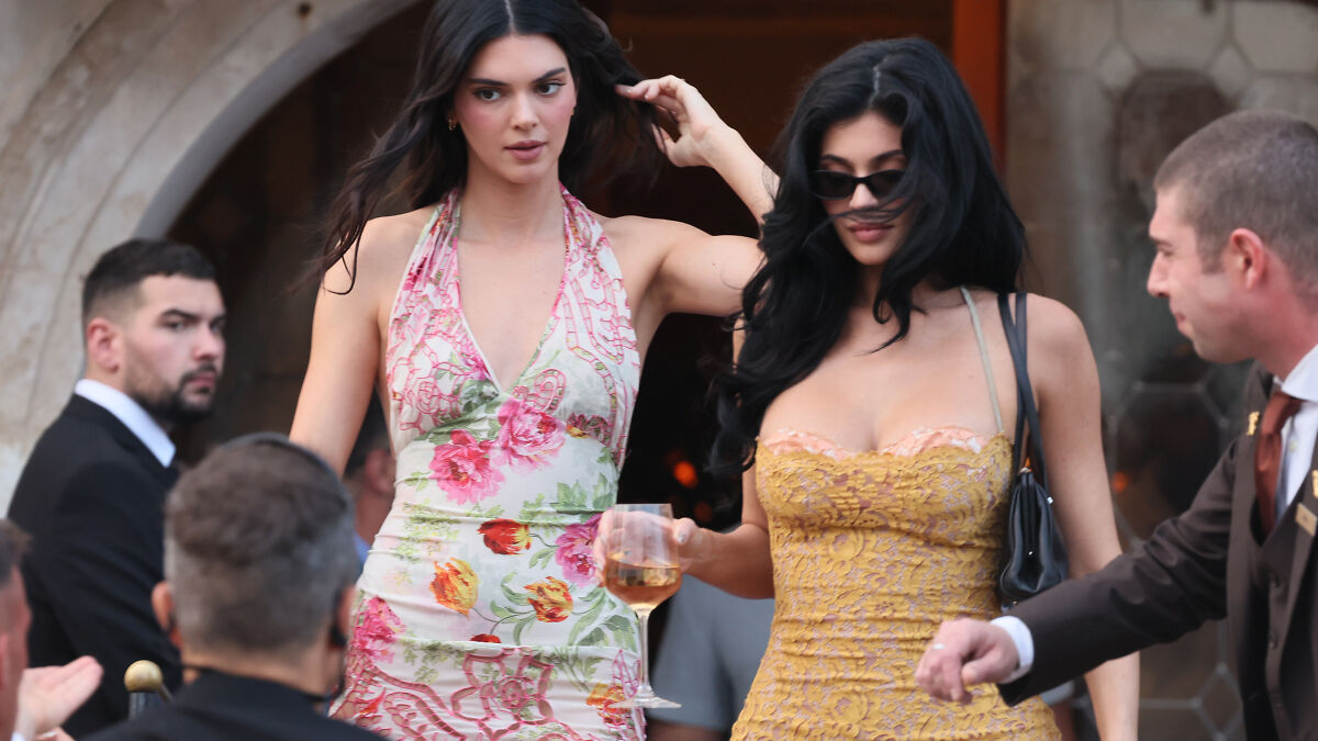 Two women in stylish dresses at a high-profile event highlighting Ozempic and plastic surgery trends.