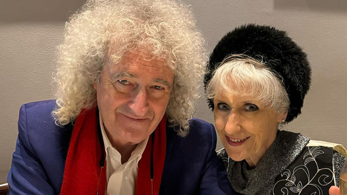 Brian May and his wife sitting together, with her breaking silence on Freddie Mercury lovechild claims.