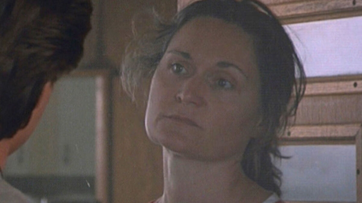 Unrecognizable beloved u201990s star and Tom Cruise Rain Man co-star with a serious expression in a wooden interior.