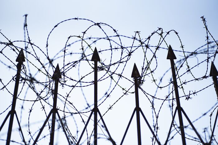 Barbed wire fence with pointed spikes creating a creepy and chilling spot in the U.S. that visitors say never again.