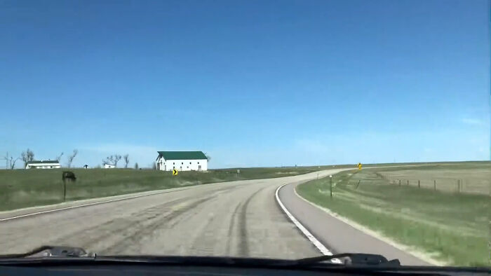 View from inside a car driving on a deserted rural road near creepy and chilling spots in the U.S.