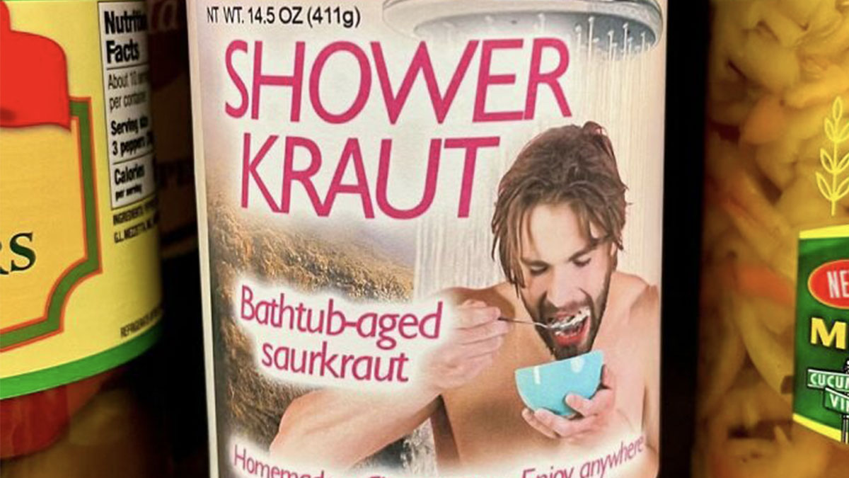 Jar of fake sauerkraut labeled shower kraut with a man eating from a bowl, part of guy sneaks fake products in stores.