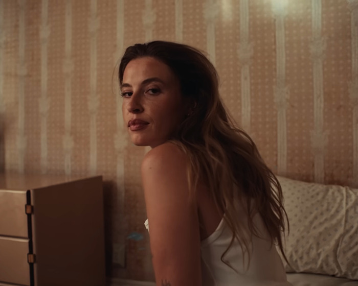 Young woman with long hair sitting indoors, representing famous lesbians who have gotten boyfriends this year trend. Young woman with long hair sitting indoors, representing famous lesbians who have gotten boyfriends this year trend.