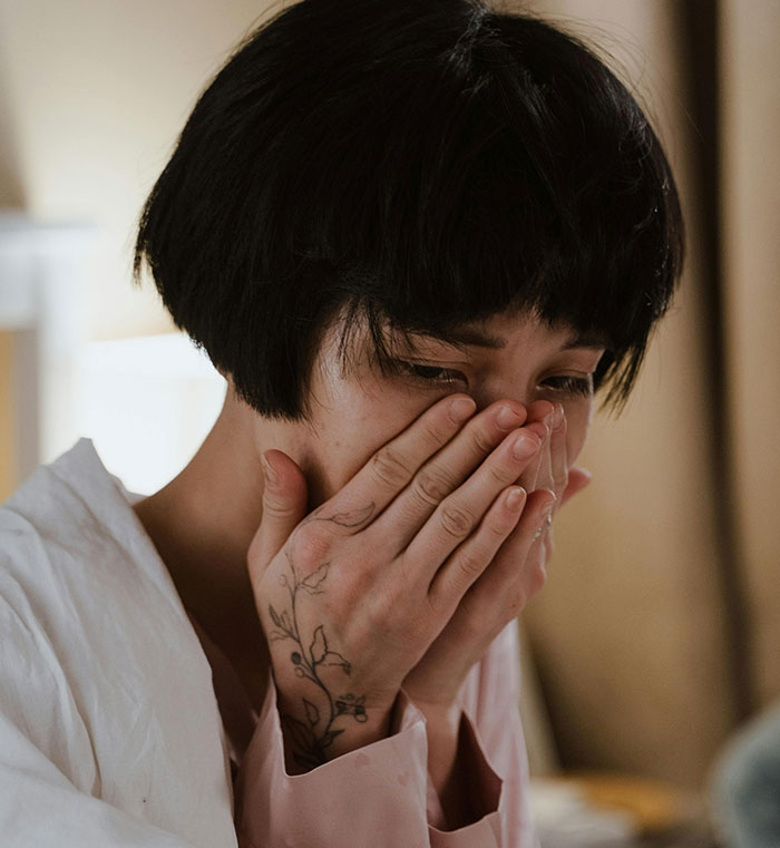 Bride looking worried and emotional as groom-to-be makes cold feet jokes before their wedding day. Bride looking worried and emotional as groom-to-be makes cold feet jokes before their wedding day.