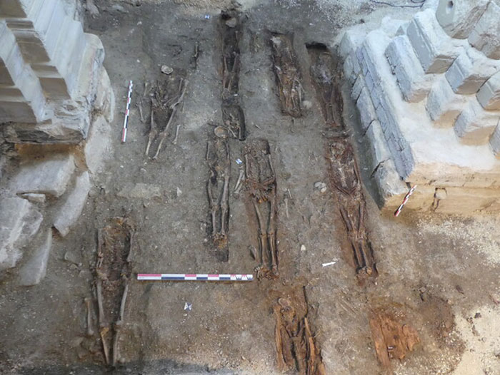 Skeletons of a 400-year-old burial vault uncovered during archaeological excavation at church restoration site. Skeletons of a 400-year-old burial vault uncovered during archaeological excavation at church restoration site.