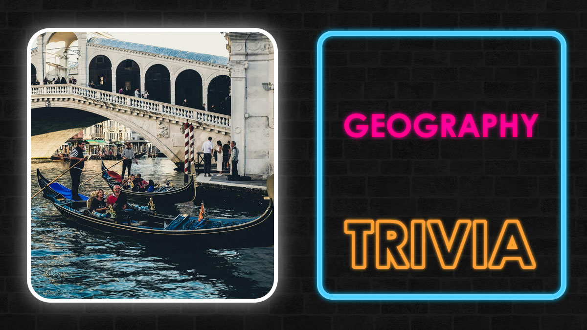 Gondolas on Venice canal near a stone bridge next to neon sign reading geography trivia in bright colors.