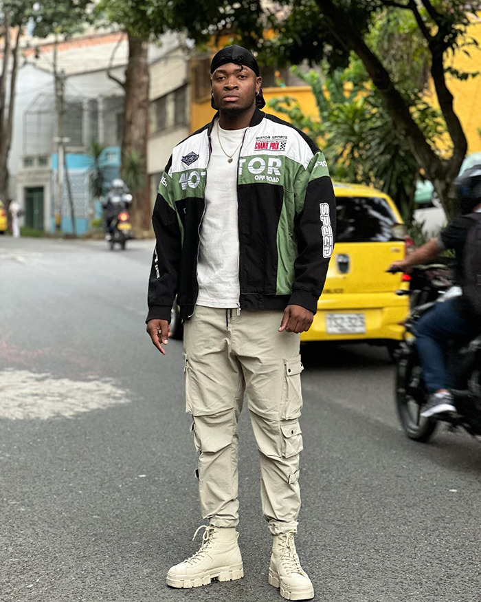 Young man in casual streetwear standing on road, representing homeless man makeover and viral downgrade story. Young man in casual streetwear standing on road, representing homeless man makeover and viral downgrade story.