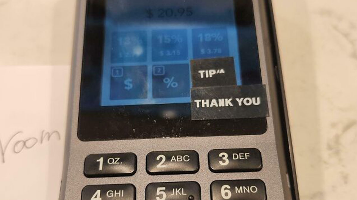 Payment terminal showing tip options with labels for tipping culture in a humorous context