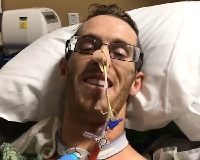 Man with glasses lying in hospital bed with medical tubes after beginner Jiu-Jitsu student injury sparring incident. Man with glasses lying in hospital bed with medical tubes after beginner Jiu-Jitsu student injury sparring incident.