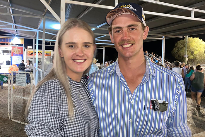 Young woman and man smiling together at an outdoor event, related to woman who set male friend on fire case. Young woman and man smiling together at an outdoor event, related to woman who set male friend on fire case.