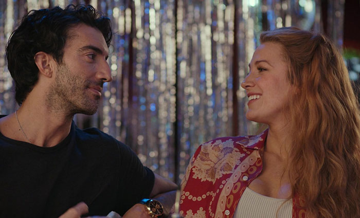 Two people smiling and talking in a casual setting, highlighting Taylor Swift ghosting Blake Lively despite groveling efforts. Two people smiling and talking in a casual setting, highlighting Taylor Swift ghosting Blake Lively despite groveling efforts.