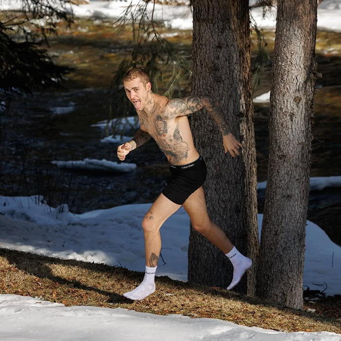 Justin Bieber running shirtless outdoors in winter, displaying tattoos during a moment linked to an aggressive meltdown. Justin Bieber running shirtless outdoors in winter, displaying tattoos during a moment linked to an aggressive meltdown.