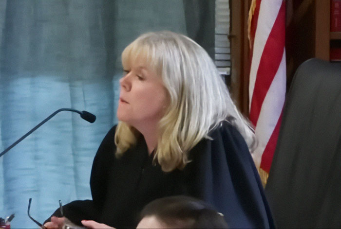 Woman in a courtroom setting during a trial related to Karen Read acquitted in slaying of cop boyfriend case. Woman in a courtroom setting during a trial related to Karen Read acquitted in slaying of cop boyfriend case.